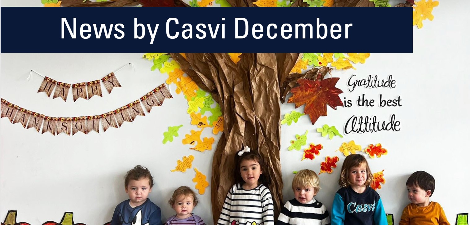 Niños de Nursery de Casvi Tres Cantos posando en una decoración de Acción de Gracias