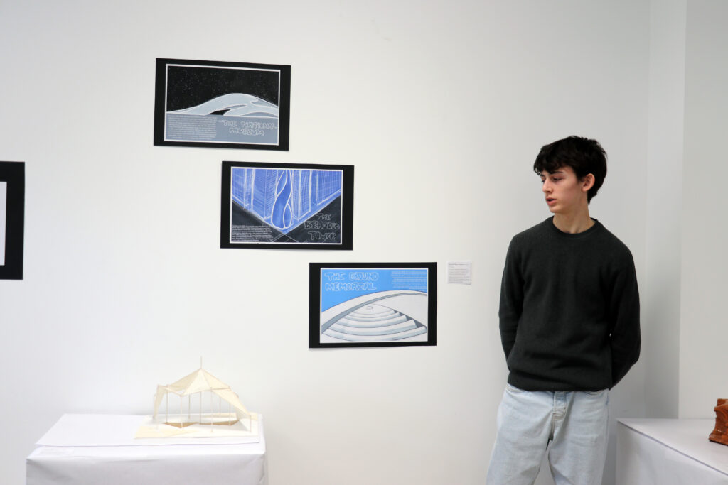 Student displays his work IB at Casvi