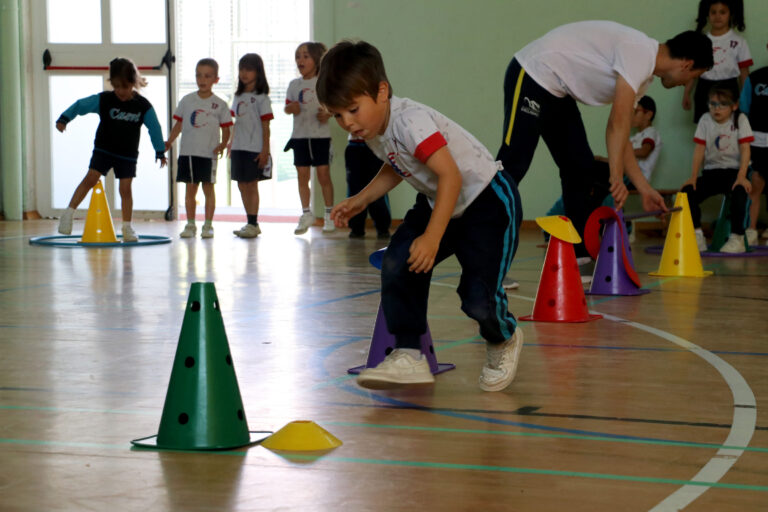 Two boys from Casvi playing ball in a sports challenge